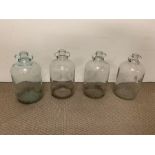 Four glass demi john bottles