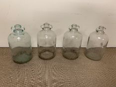 Four glass demi john bottles