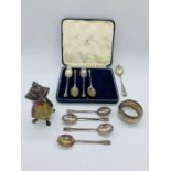 A small collection of silver to include pepper pot, spoons etc.