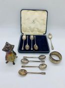 A small collection of silver to include pepper pot, spoons etc.