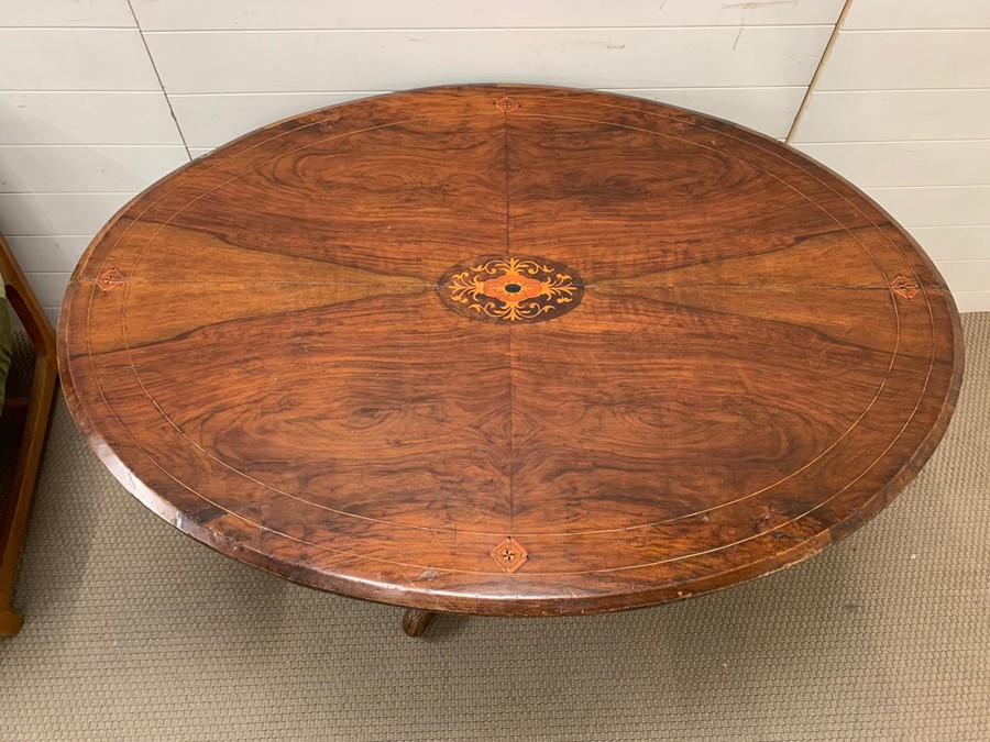 A mahogany breakfast table with inlay tilt top and tripod base H78cm x W 97cm x L 131cm - Image 3 of 4