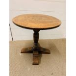 A small oak occasional table (H45cm Dia 45cm)