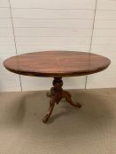 A mahogany breakfast table with inlay tilt top and tripod base H78cm x W 97cm x L 131cm