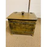 A Brass Coal Box with liner and lion handles.