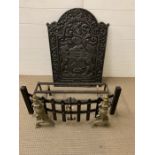 A cast iron fire place back plate, cast with a coat of arms along with grate and fire dogs (H77cm
