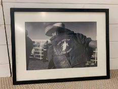 A black and white signed photograph of John Lynn Texas 97 cowboy (61cm x 45cm)