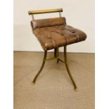 A brass framed Harpists stool with button back leather seat pad. H58cm x W 36cm