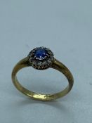 A Diamond and Sapphire 18 ct gold ring (3.3g) size P