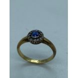 A Diamond and Sapphire 18 ct gold ring (3.3g) size P