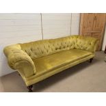 Three seater Chesterfield style sofa on turned legs (230 cm x 98 cm x 68 cm)