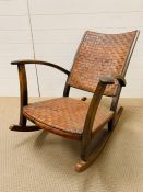 A leather crossed strap Rocking Chair