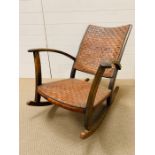 A leather crossed strap Rocking Chair