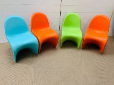 Four Verner Panton stacking chairs of single form injections, molded and signed