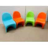 Four Verner Panton stacking chairs of single form injections, molded and signed