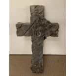 A carved stoned weathered cross