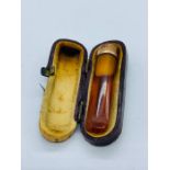 A Vintage Amber and 9ct gold cigarette holder, makers mark AJC, hallmarked Birmingham, cased.