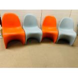 Four Verner Panton children's stacking chairs of single form injections, molded and signed