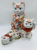 Three oriental ornamental cats.