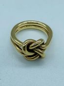 A 9 ct yellow gold knot style ring (9.4g) Size N