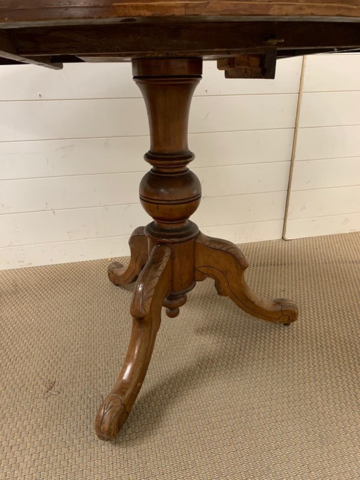 A mahogany breakfast table with inlay tilt top and tripod base H78cm x W 97cm x L 131cm - Image 4 of 4