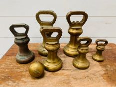 A Collection of Brass weights by Avery 2 x 7lbs 2 x 4lbs 1 x 2lbs 1 x 1lb