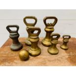 A Collection of Brass weights by Avery 2 x 7lbs 2 x 4lbs 1 x 2lbs 1 x 1lb