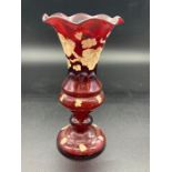 A Victorian Ruby glass hand blown vase, hand painted with grape vine detail
