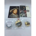 A selection of collectable coins including two £5 coin packs Henry VIII and The Restoration of the