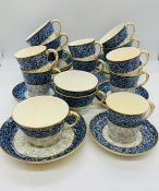 A selection of blue and white floral design coffee and tea cups and saucers