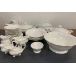 A selection of white crockery to include, lidded pots, jugs and plates