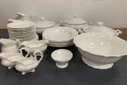 A selection of white crockery to include, lidded pots, jugs and plates