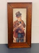 A framed print of a man playing a wind instrument and carrying a bugle