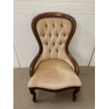 A Low Button Back or Nursing Chair.
