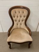 A Low Button Back or Nursing Chair.