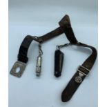A leather guild belt with whistle and pen knife