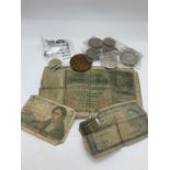 A small box of collectable crowns, a two pound coin and three banknotes.