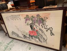 A large framed oriental print featuring cherry blossom, signed