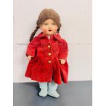 An Antique German Doll with HJ initials to base of neck in corduroy red coat.