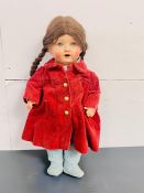 An Antique German Doll with HJ initials to base of neck in corduroy red coat.