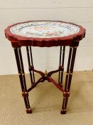 A Franklin Mint platter with wooden stand