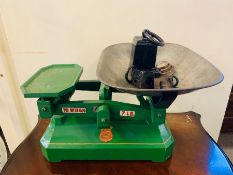 A green Co Op weight scales and weights