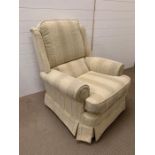 An upright easy arm chair in soft furnishings