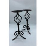 A pair of metal candlestick holders