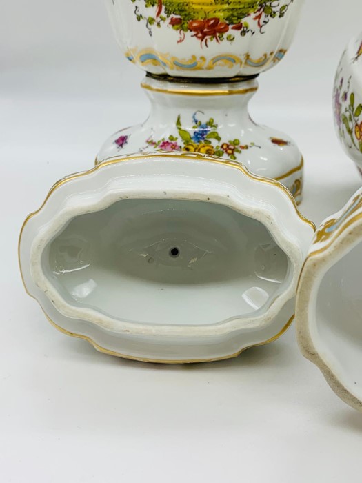 A pair of porcelain vases with lids, painted with exotics birds and scattered springs, stamped - Image 4 of 5