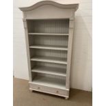 A painted pine shelving unit with drawers under (H202cm W108cm D42cm)