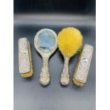 A Set of four hallmarked silver backed dressing table brushes.