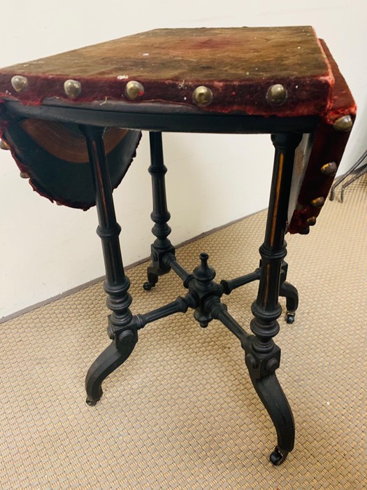 Velvet and studded drop sided occasional table on ebonized legs and castors - Image 2 of 2