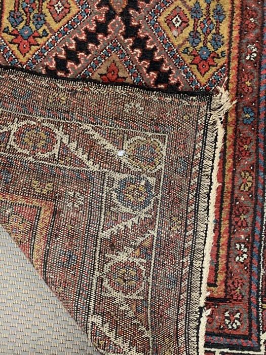 A red, orange and blue coloured runner with a diamond pattern to center (296cm x 110cm) - Image 2 of 2