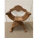 An X Frame, collapsible, Teak Chair.