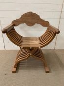 An X Frame, collapsible, Teak Chair.